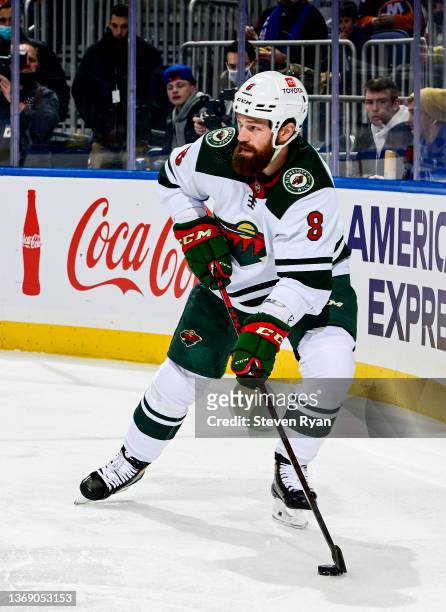 Jordie Benn of the Minnesota Wild carries the puck against the New York Islanders at UBS Arena on January 30, 2022 in Elmont, New York.