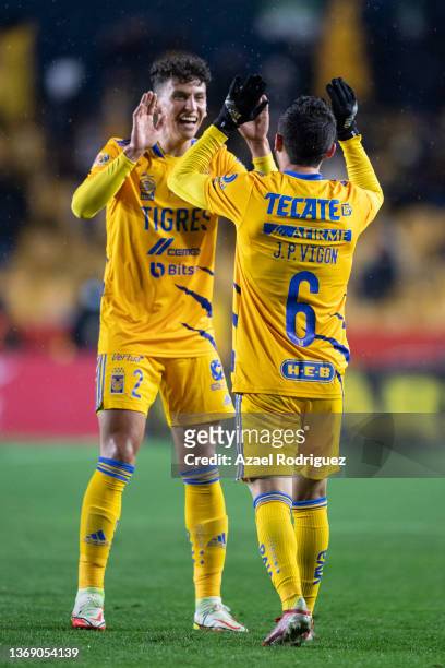 Juan Vigón of Tigres celebrates with teammate Igor Lichnovsky after scoring his team's first goal during the 4th round match between Tigres UANL and...