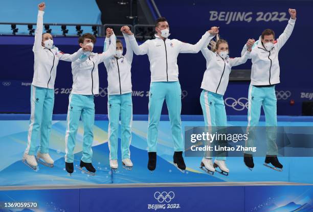 Gold medalists Team ROC celebrate during the Team Event flower ceremony on day three of the Beijing 2022 Winter Olympic Games at Capital Indoor...