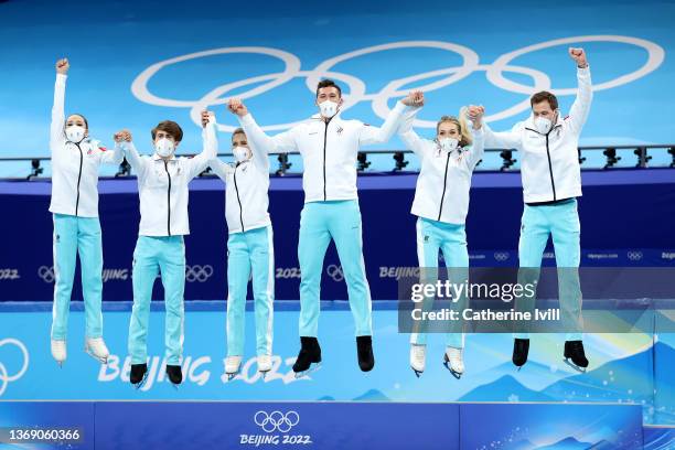 Gold medalists Team ROC celebrate during the Team Event flower ceremony on day three of the Beijing 2022 Winter Olympic Games at Capital Indoor...