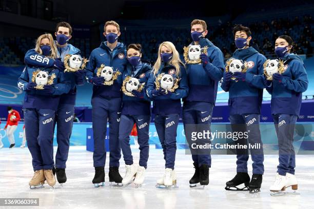 Silver medalists Team United States pose during the Team Event flower ceremony on day three of the Beijing 2022 Winter Olympic Games at Capital...
