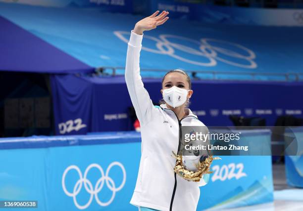 Gold medalists Kamila Valieva of Team ROC celebrate during the Team Event flower ceremony on day three of the Beijing 2022 Winter Olympic Games at...