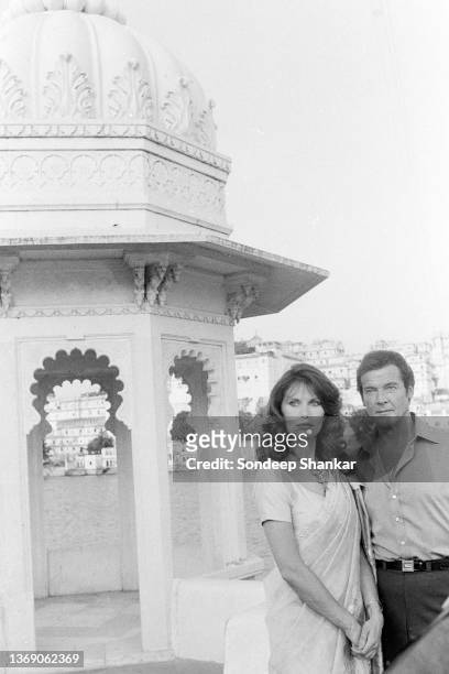 Lead actors Maud Adams and Roger Moore on the sets of shooting for film Octopussy, the 13th in James Bond series at Lake Palace in Udaipur,...