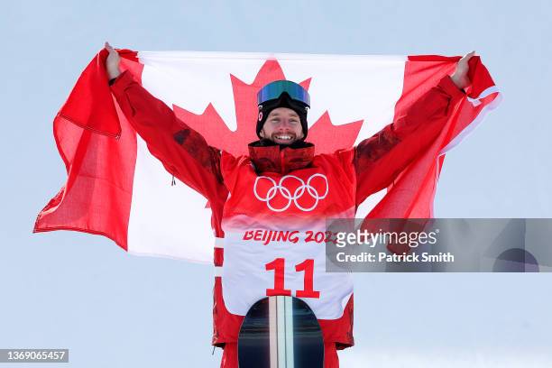 Gold medallist Max Parrot of Team Canada celebrates during the Men's Snowboard Slopestyle flower ceremony at Genting Snow Park on February 07, 2022...
