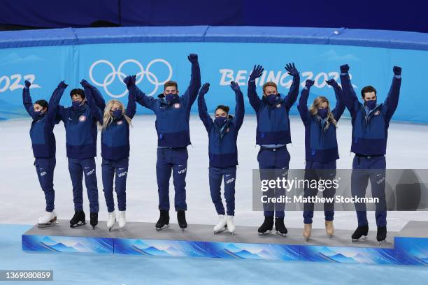 Silver medalists Team United States celebrate during the Team Event flower ceremony on day three of the Beijing 2022 Winter Olympic Games at Capital...