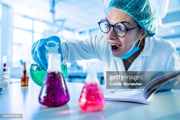 mad female scientist mixing toxic substances in laboratory. - chemical reaction stock pictures, royalty-free photos & images