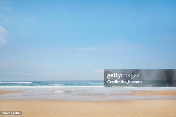 beach and sea against blue sky in summer - france beach stock pictures, royalty-free photos & images
