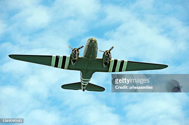 historic dakota troop transport flying directly overhead the english channel, england - propeller airplane bildbanksfoton och bilder