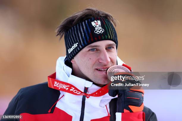 Bronze medalist Matthias Mayer of Team Austria celebrates during the Men's Downhill medal ceremony on day three of the Beijing 2022 Winter Olympic...