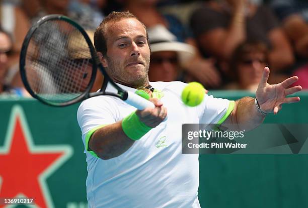 Olivier Rochus of Belguim plays a shot in his singles match against Philipp Kohlschreiber of Germany during day five of the 2012 Heineken Open at the...