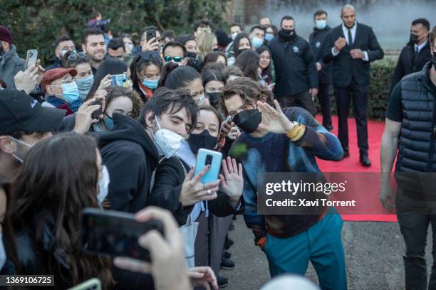Actor Tom Holland greets the fans during the presentation of the movie 'Uncharted' on February 07, 2022 in Barcelona, Spain.