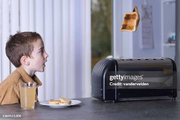 boy at break time - kitchen island stock pictures, royalty-free photos & images