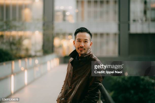 portrait of man in city in winter - cool man leather bildbanksfoton och bilder