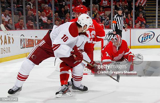 Jimmy Howard of the Detroit Red Wings makes a save on a shot by Rostislav Klesla of the Phoenix Coyotes during the third period at Joe Louis Arena on...