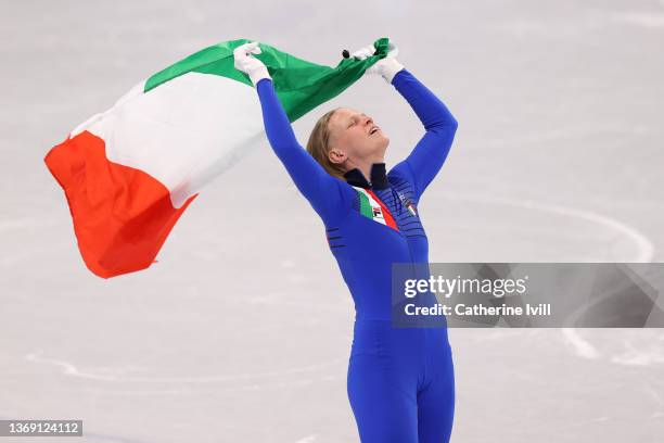 Arianna Fontana of Team Italy celebrates winning the Gold medal during the Women's 500m Final A on day three of the Beijing 2022 Winter Olympic Games...