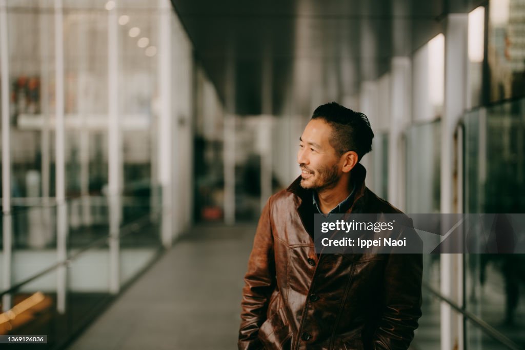 Portrait of Japanese man in city