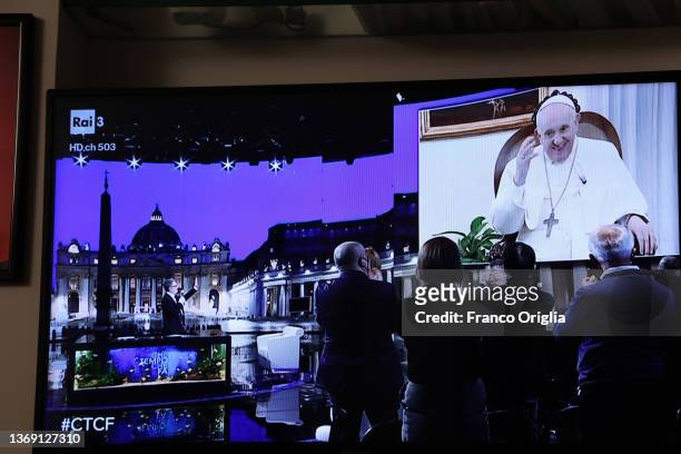 Woman watches tv as Pope Francis appears on the RAI1 Italian television programme “Che tempo che fa” for a conversation with host Fabio Fazio on...