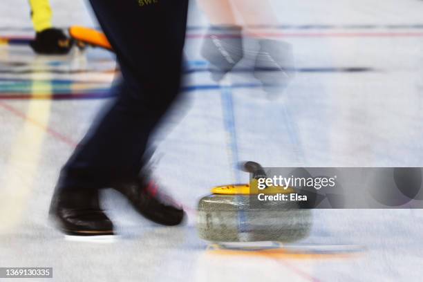 Oskar Eriksson of Team Sweden sweeps while competing against Team Italy during the Curling Mixed Doubles Round Robin on Day 3 of the Beijing 2022...