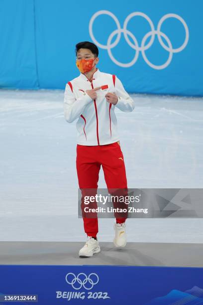 Gold medallist Ziwei Ren of Team China celebrates during the Men's 1000m flower ceremony on day three of the Beijing 2022 Winter Olympic Games at...