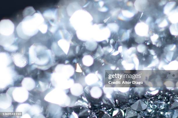 detail of a piece of jewelry with inlays that look like diamonds. - namaakjuweel stockfoto's en -beelden
