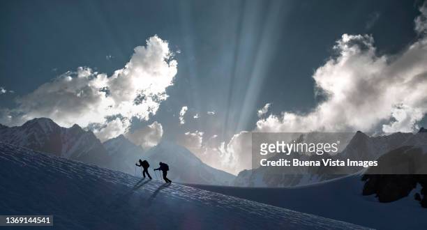 climbers on a snowy slope - can't decide where to go stock pictures, royalty-free photos & images