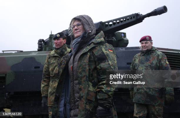 German Defence Minister Christine Lambrecht stands next to a Puma infantry fighting vehicle as she attends a demonstration of capabilities of the 9th...