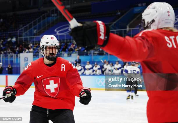 Alina Muller and Lara Stalder of Team Switzerland celebrate a goal against Team Finland during the third period during the Women's Preliminary Round...