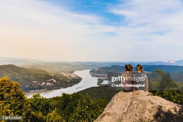 couple of women enjoying the danube river view, pest county, hungary - hungary landscape stock pictures, royalty-free photos & images