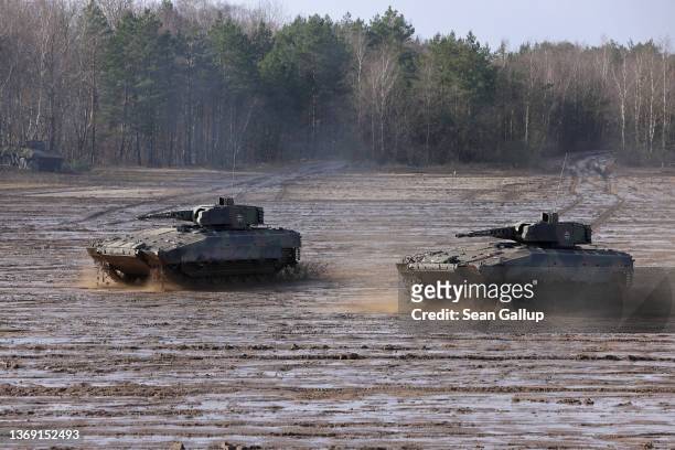 Puma infantry fighting vehicles of the Bundeswehr's 9th Panzer Training Brigade participate in a demonstration of capabilities during a visit by...
