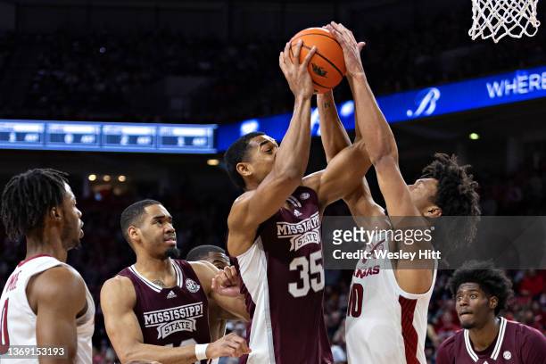 Tolu Smith of the Mississippi State Bulldogs goes up for a shot against Jaylin Williams of the Arkansas Razorbacks at Bud Walton Arena on February...