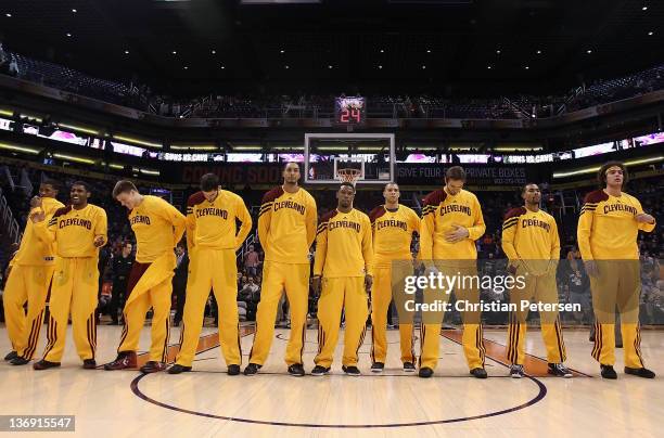 The Cleveland Cavaliers stand attended for the National Anthem before the NBA game against the Phoenix Suns at US Airways Center on January 12, 2012...