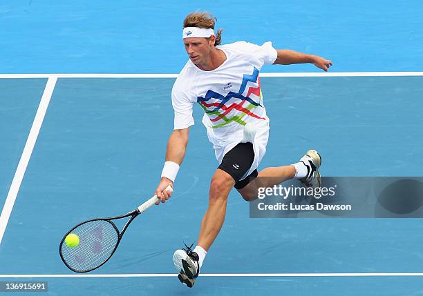 David Nalbandian of Argentina plays a forehand during his exhibition match against Andy Murray of Great Britian during day three of the 2012 Kooyong...