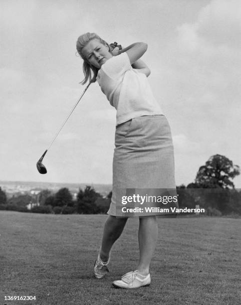 English golfer Diane Robb Frearson a member of the Great Britain and Ireland Curtis Cup team tees off during a practice round on 1st August 1962 at...