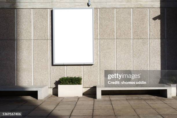 architectural features of a building with blank billboard on wall - poster wall stockfoto's en -beelden