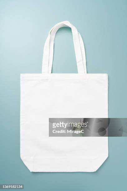 reusable white cotton shopping bag - tote bag stock pictures, royalty-free photos & images