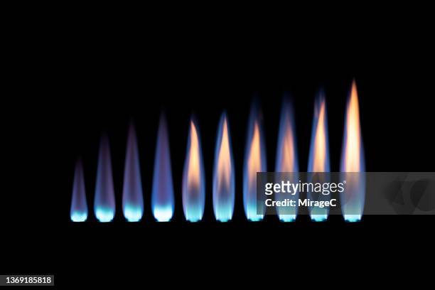 blue flame of gas blowtorch from short to long variation - quemador fotografías e imágenes de stock
