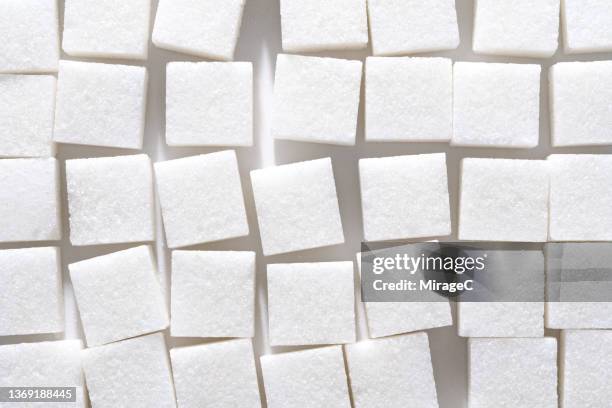 stacked sugar cubes full frame texture - excess sugar stock pictures, royalty-free photos & images