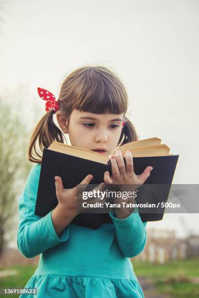 the child prays selective focus people kids - girl hold nose stock pictures, royalty-free photos & images