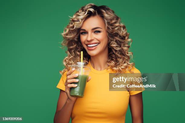 woman drinking detox juice - woman smoothie stock pictures, royalty-free photos & images