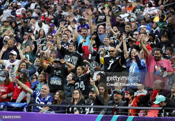 Fans react to a television camera pointing at them during the 2022 NFL Pro Bowl at Allegiant Stadium on February 06, 2022 in Las Vegas, Nevada. The...