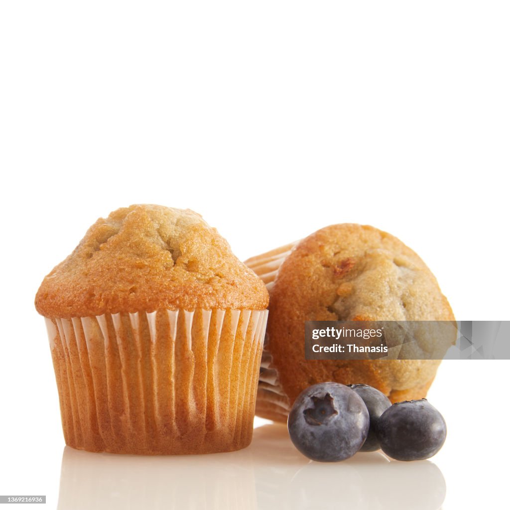 Blueberry muffins on white background, close-up