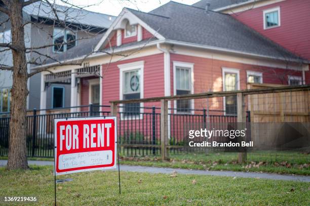 For Rent' sign is posted near a home on February 07, 2022 in Houston, Texas. Since March 2020, the estimated median rent of new leases has increased...