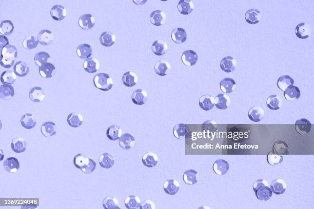 pastel violet festive background made of many round purple silver sequins. holidays celebration concept. demonstrating very peri - color of 2022 year - sequin stock pictures, royalty-free photos & images