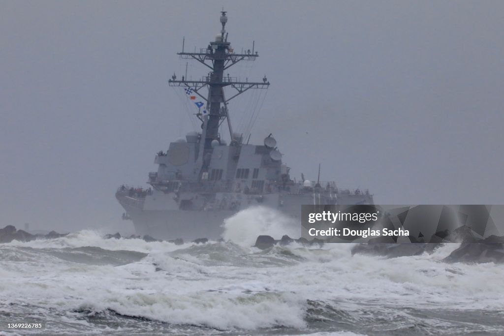 Military ship sailing into the storm