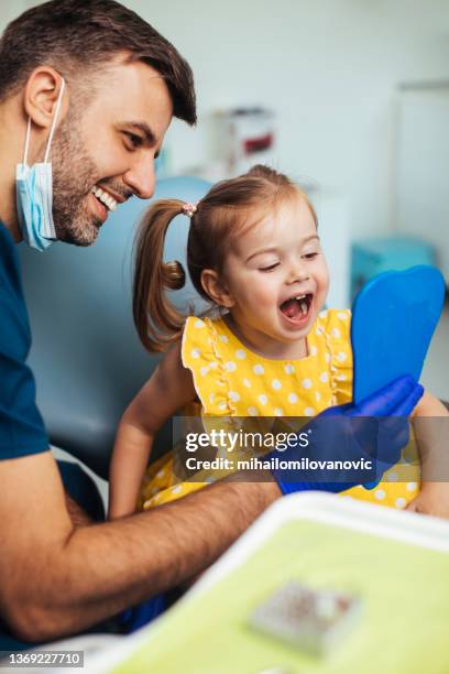 open wide so we can check everything - dentists stock pictures, royalty-free photos & images