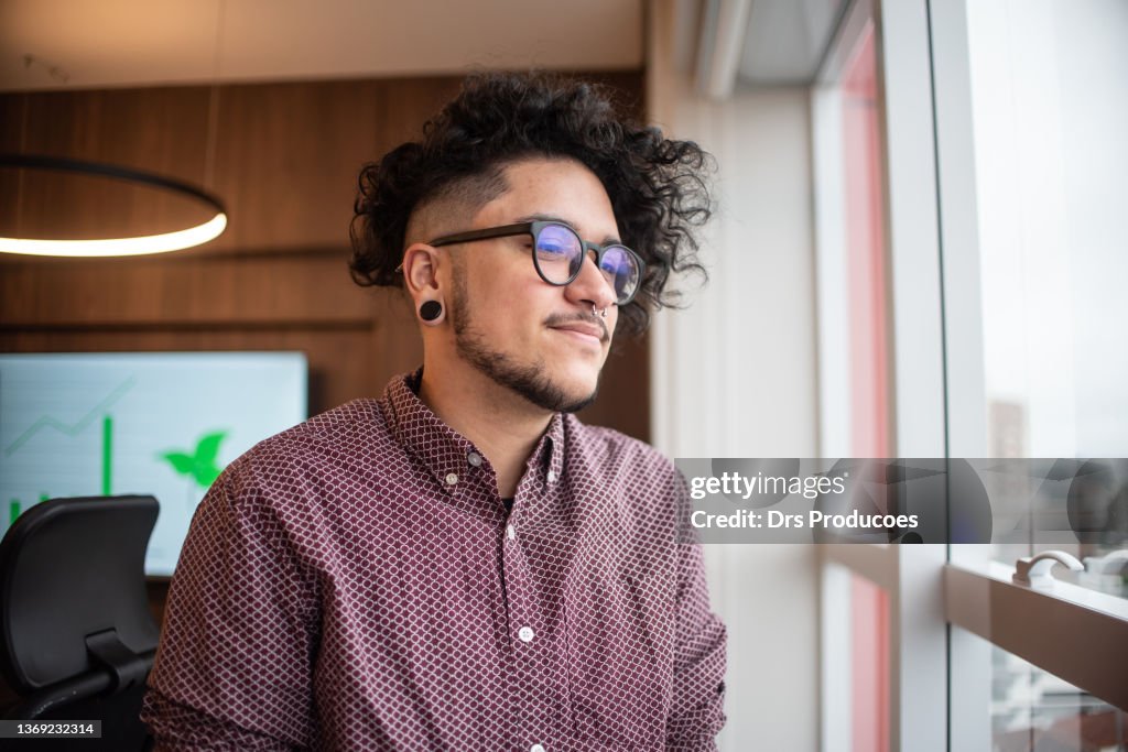 Portrait of trans man looking at view