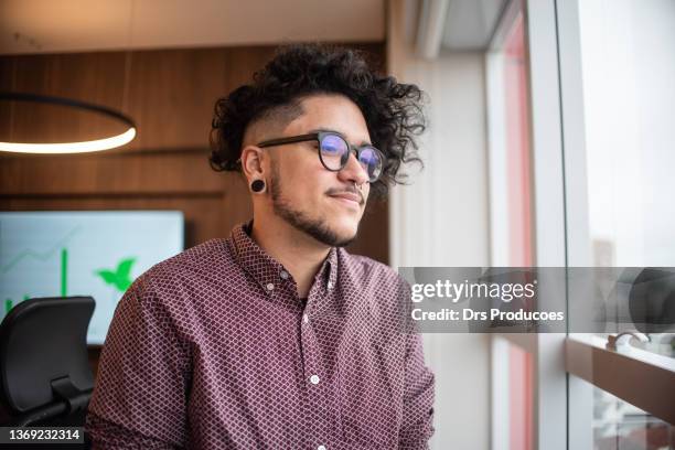 portrait of trans man looking at view - lgbtqi people stock pictures, royalty-free photos & images