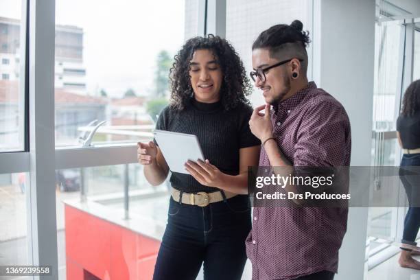 black woman and trans man at business meeting - transgender stock pictures, royalty-free photos & images