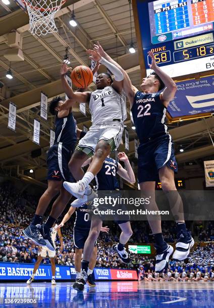 Jayden Gardner and Francisco Caffaro of the Virginia Cavaliers defend Trevor Keels of the Duke Blue Devils during the second half of their game at...