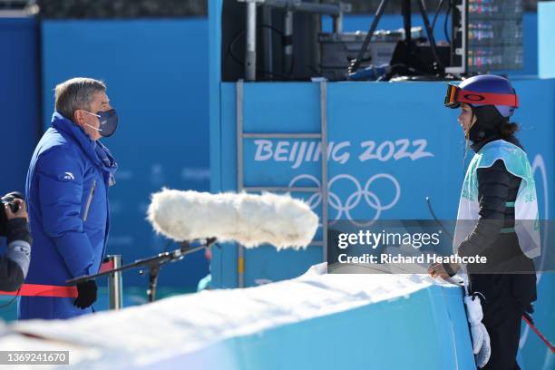 Ailing Eileen Gu of Team China speaks to Thomas Bach, IOC President after winning the gold medal during the Women's Freestyle Skiing Freeski Big Air...